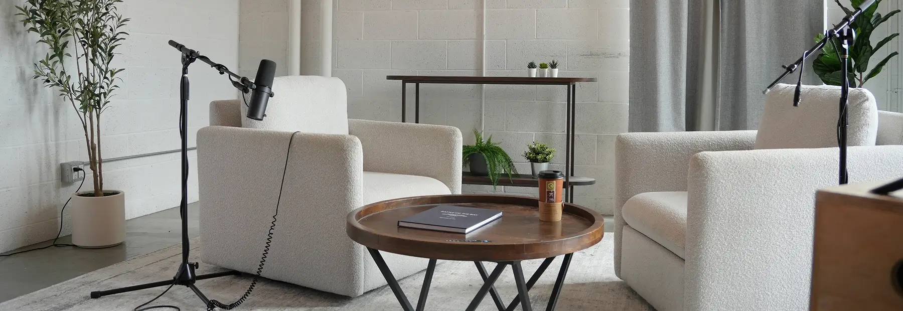 two chairs with podcast microphones