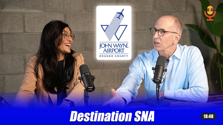 "Destination SNA" podcast thumbnail showing a man and woman speaking into microphones, with the John Wayne Airport Orange County logo between them.